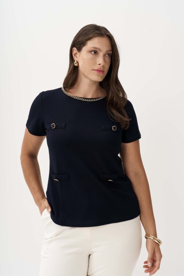 Blouse with chain at the neckline